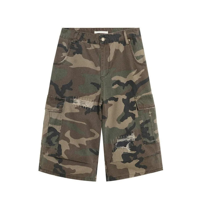 Men's loose camouflage cropped jeans with ripped knees and retro patch detailing on a thin cotton fabric.