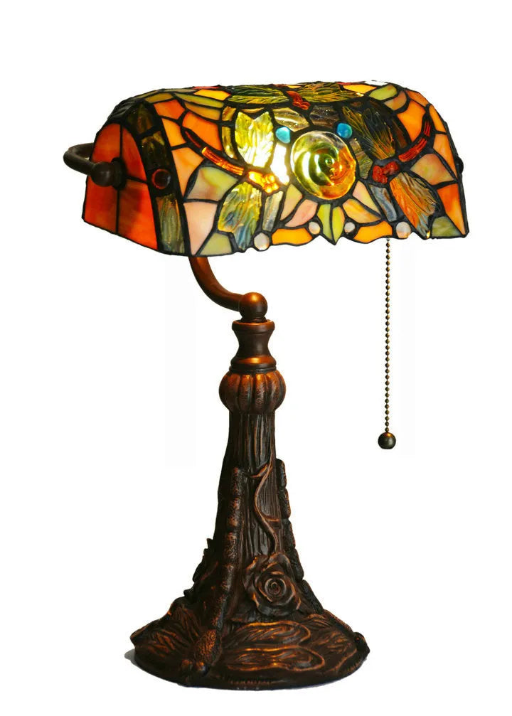 10-inch tall Tiffany table lamp with multi-coloured stained glass shade on a resin base.