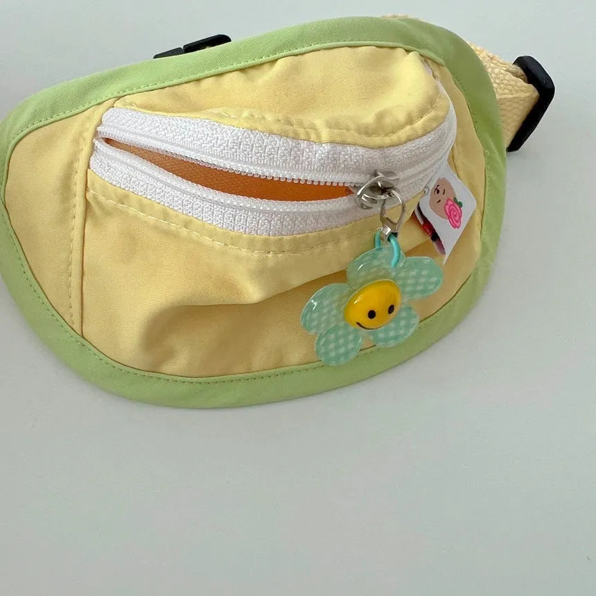 Pink or yellow backpack-style pet carrier for small dogs and cats with adjustable straps and attached poop bag holder.