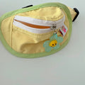 Pink or yellow backpack-style pet carrier for small dogs and cats with adjustable straps and attached poop bag holder.