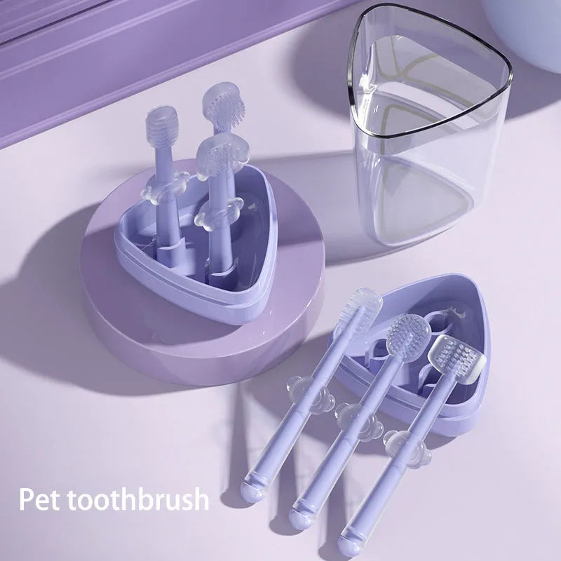 Blue, green, and purple silicone finger toothbrushes for cleaning cat and dog teeth.
