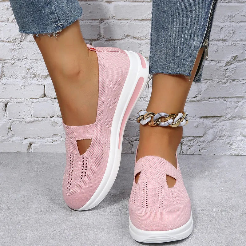 Flat platform wedge casual sneakers with mesh upper, round toe, and rubber sole in black, blue, and pink colours