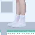 White PVC women's waterproof shoe covers high top design with reusable construction for rain protection