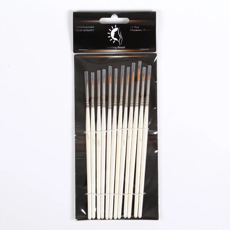 Set of 12 Pearl White artist paint brushes with nylon wool bristles, metal ferrules, and wooden handles.