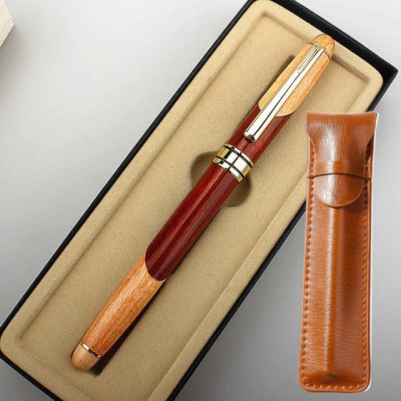 Metal ballpoint pen with wooden colour finish and black bag on white background