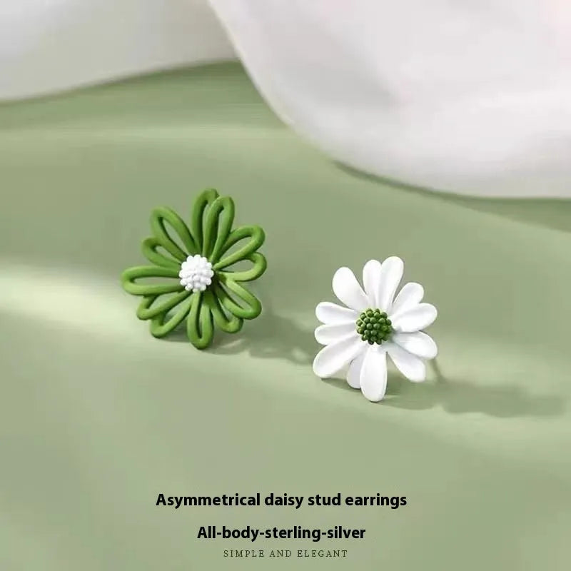 Three pairs of alloy flower earrings in blue-orange, white-green, and yellow-white colour combinations