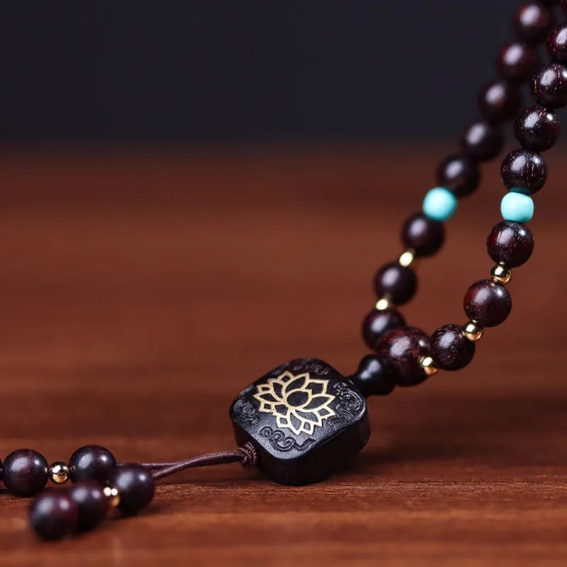 Zambia rosewood Buddha beads bracelet with flat lotus pendant showing 108 wooden beads