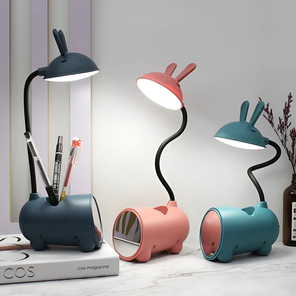 Cartoon-themed USB desk lamp with built-in pen container in green, dark blue, or pink colour options