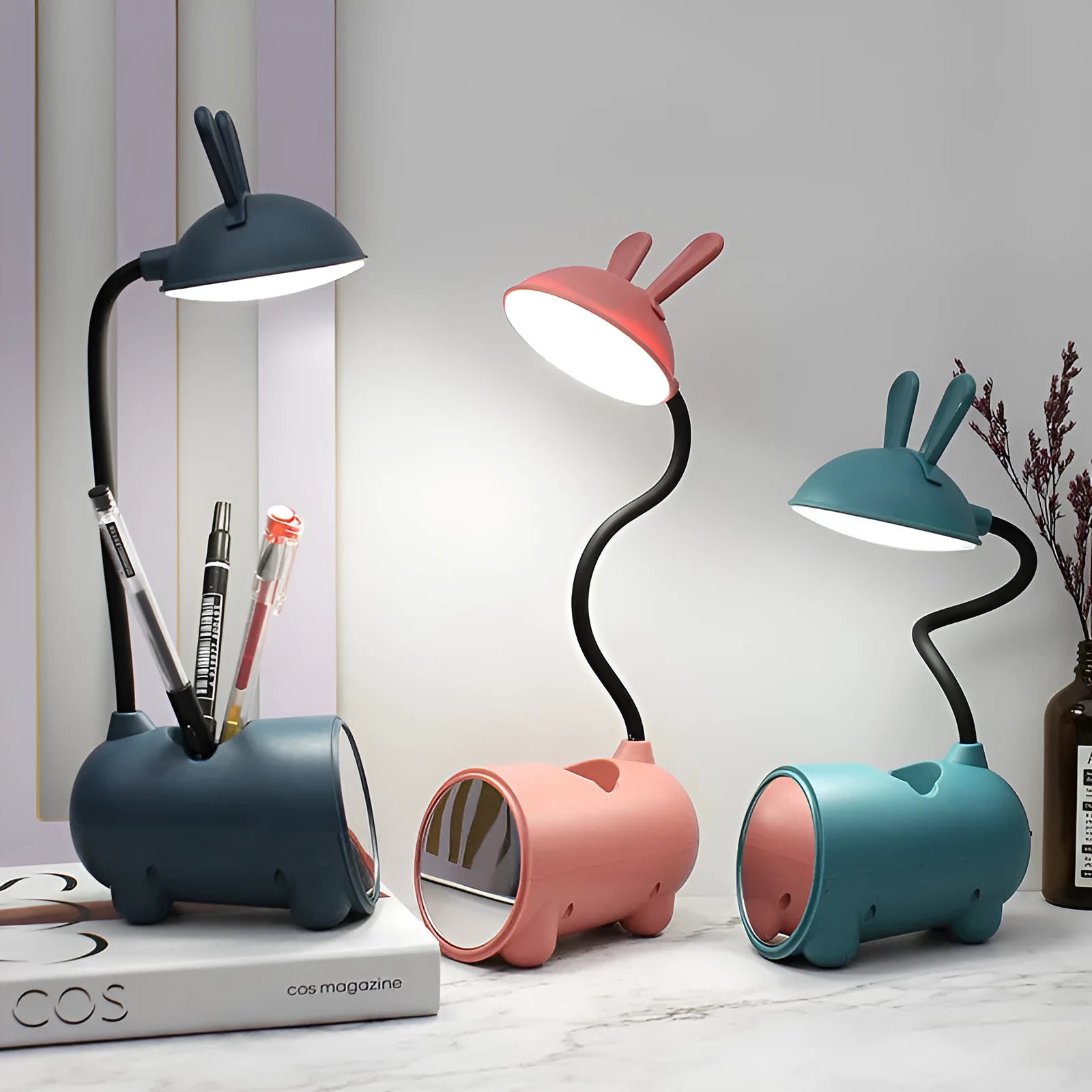 Cartoon-themed USB desk lamp with built-in pen container in green, dark blue, or pink colour options