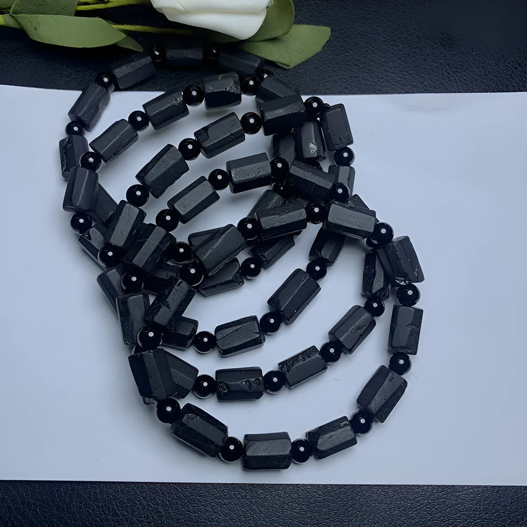 Natural black tourmaline bracelet with Seiko-treated beads approximately 9mm diameter