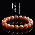 Natural pink old mine rhodochrosite round bead bracelet with a silver Ruyi charm.
