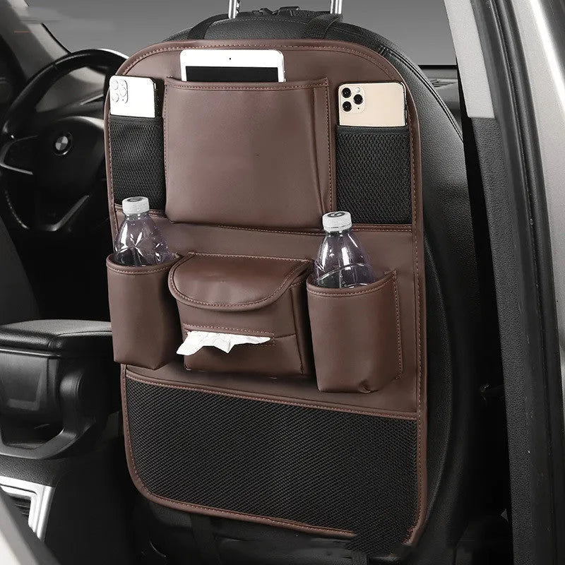 Leather car seat back storage bag in a choice of colours, shown hanging from a vehicle headrest.
