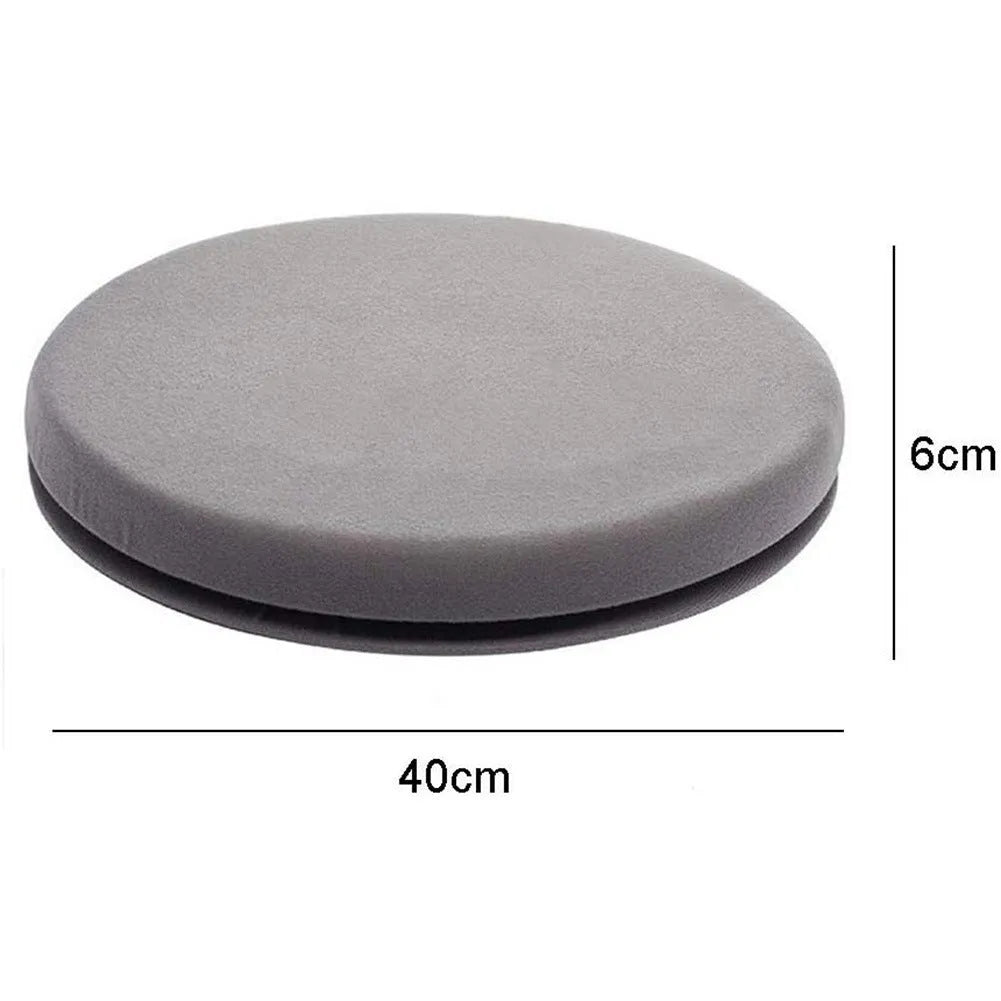 A grey rotating car seat cushion with a non-slip base, shown on a car seat.