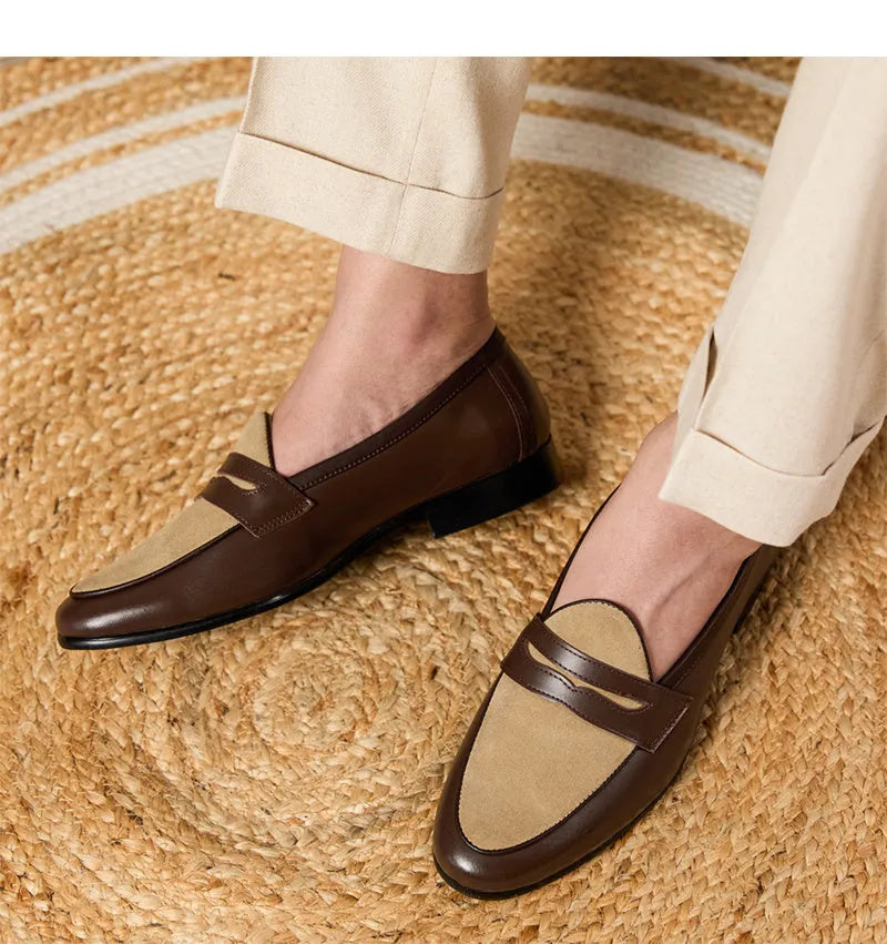 Coffee grey suede leather loafers with an elastic kick tab closure and a rubber sole.