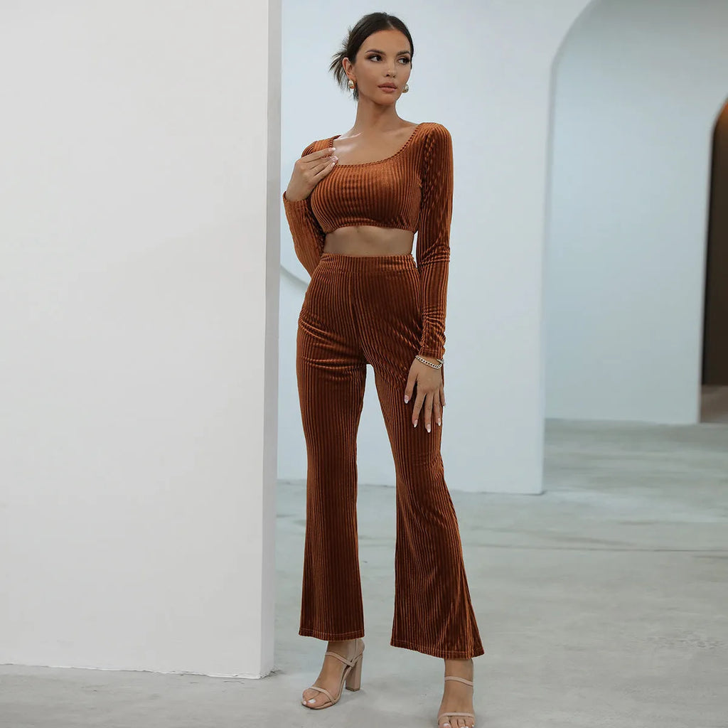 Caramel coloured women's long sleeve sweater and trouser casual set on a hanger.