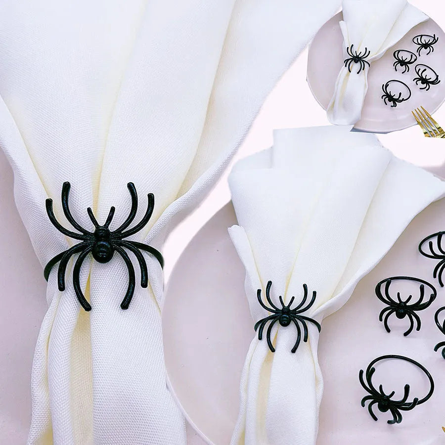 Six black spider-shaped alloy napkin rings for Halloween table decoration.