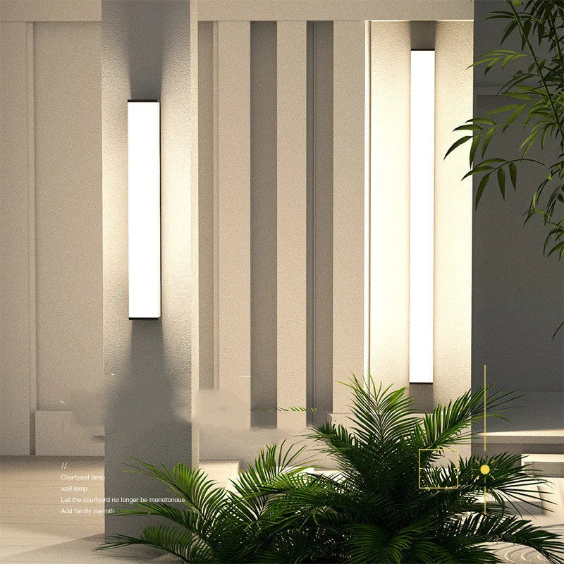 Vertical stainless steel outdoor wall light with polycarbonate diffuser, 60cm height.