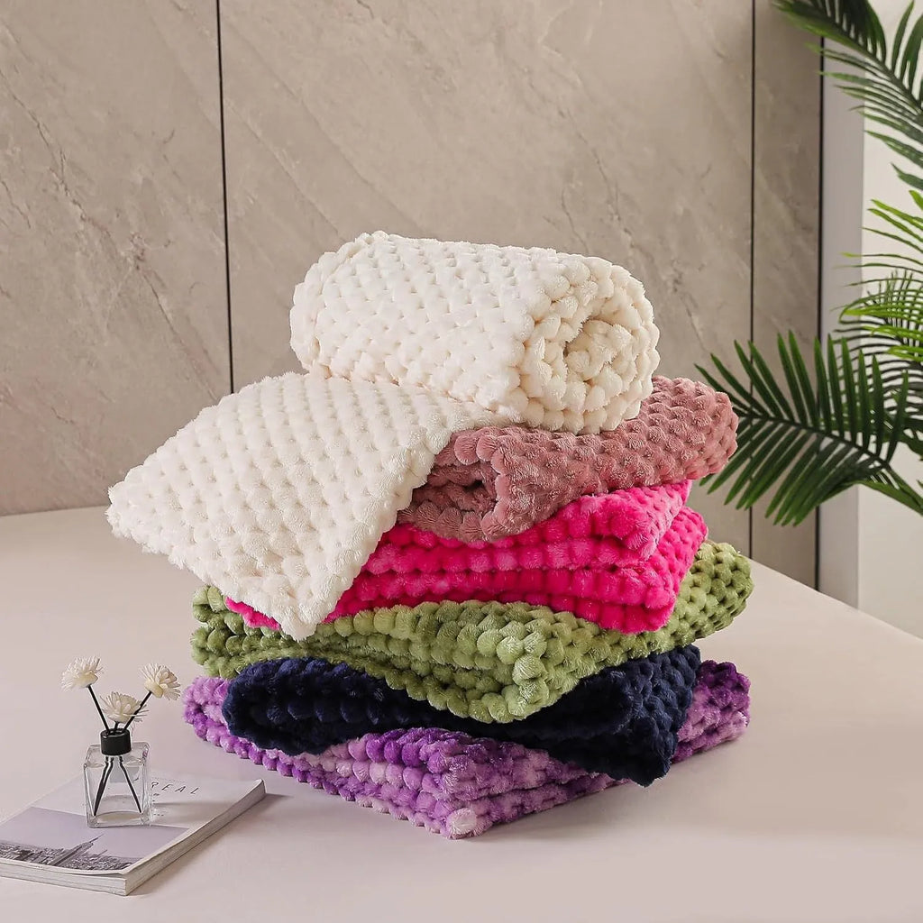 Children's polyester plaid blanket in camel colour with solid pattern showing texture