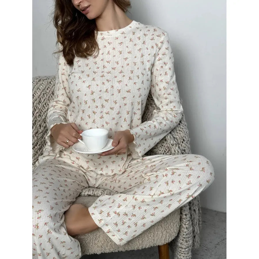 White floral print women's two-piece lounge suit with bell sleeves and wide-leg trousers