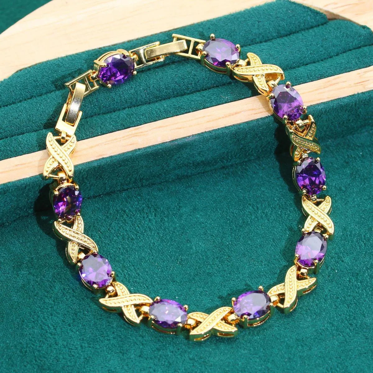 Complete 18k gold plated jewellery set showing necklace, earrings, ring and bracelet with multi-coloured cubic zirconia stones.