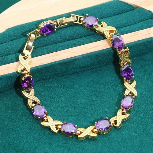 Complete 18k gold plated jewellery set showing necklace, earrings, ring and bracelet with multi-coloured cubic zirconia stones.