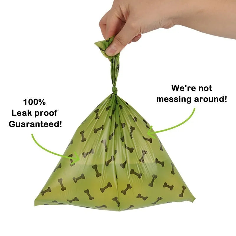 Military green degradable dog poop bags with black bone print measuring 23cm by 33cm