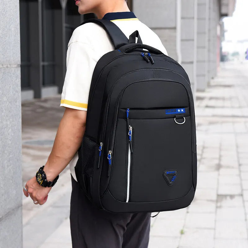 Men's Oxford cloth schoolbag in black with a large main compartment and an air pillow shoulder strap.