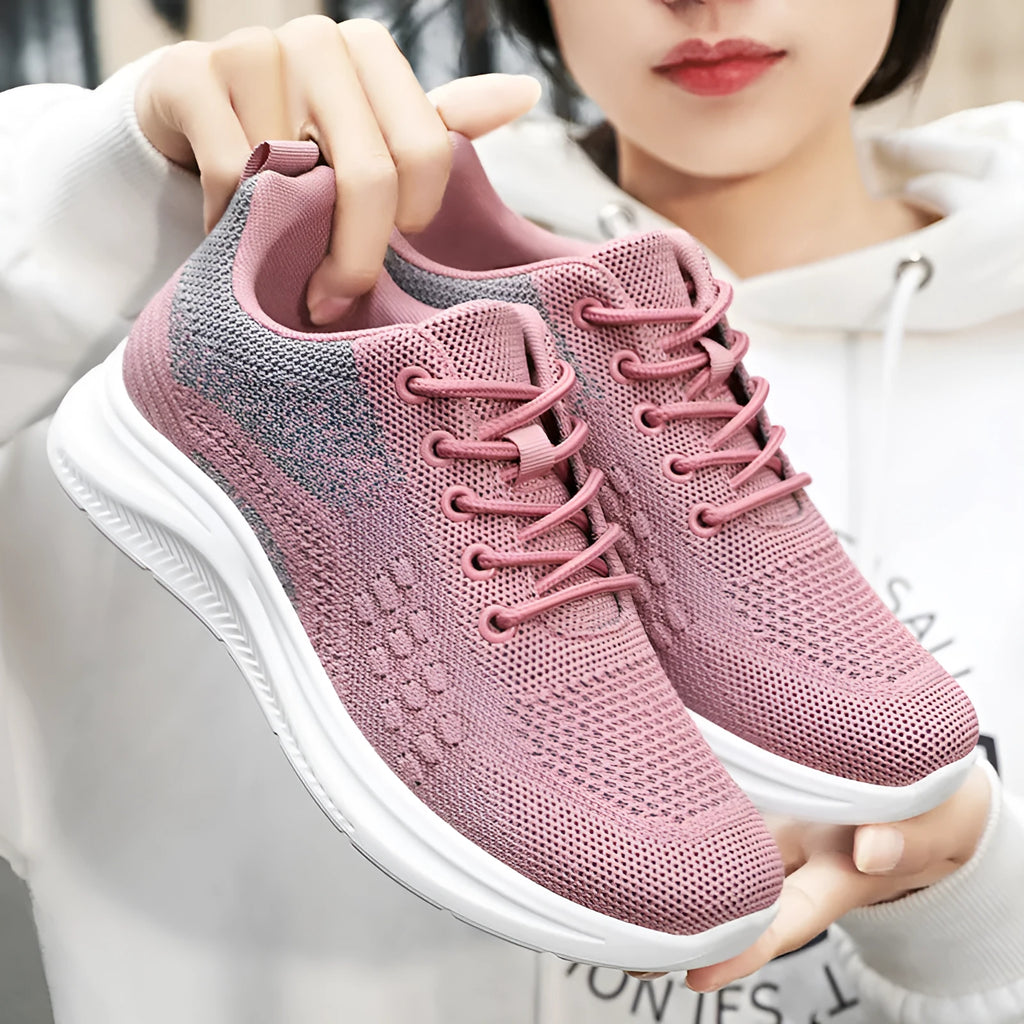 Women's black mesh sneakers with round toe and front lace-up design on soft PVC sole
