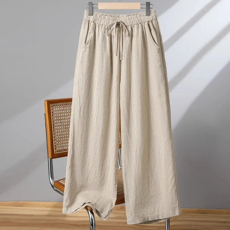 Women's straight leg casual trousers with a drawstring elastic waist in apricot colour.