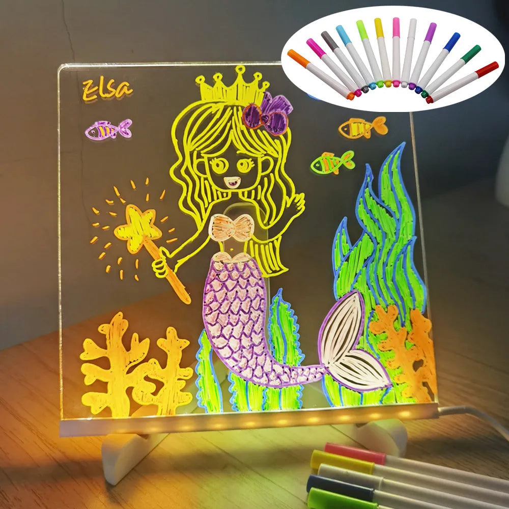 Acrylic DIY note board LED night light with USB cable, bracket, and colourful pens on a desk