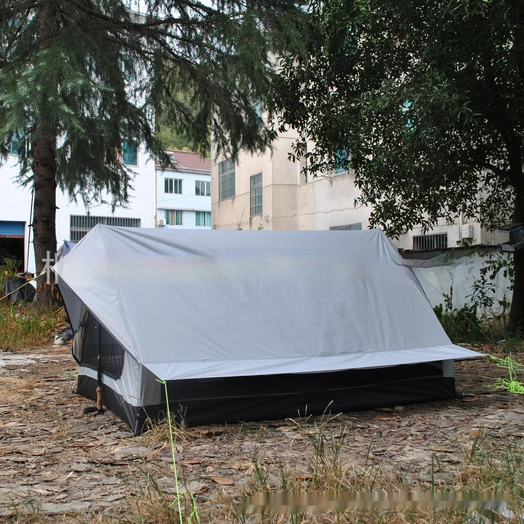 Brown A-line pole-free cabin tent set up with hiking poles showing spacious interior for 2-3 campers