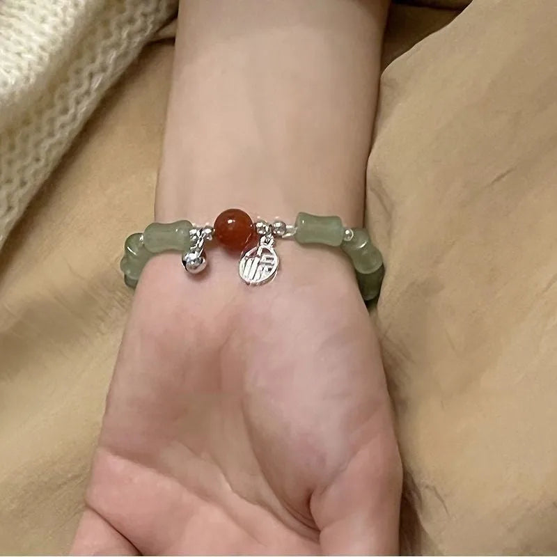Chinese style glass bamboo leaf bracelet for women with manual craft details.