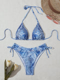Women's denim blue printed bikini set with strap design, showing front and back views
