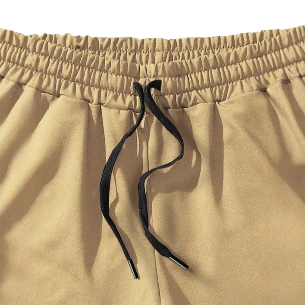 Men's khaki coconut print sports shorts with straight cut design and micro elastic fabric