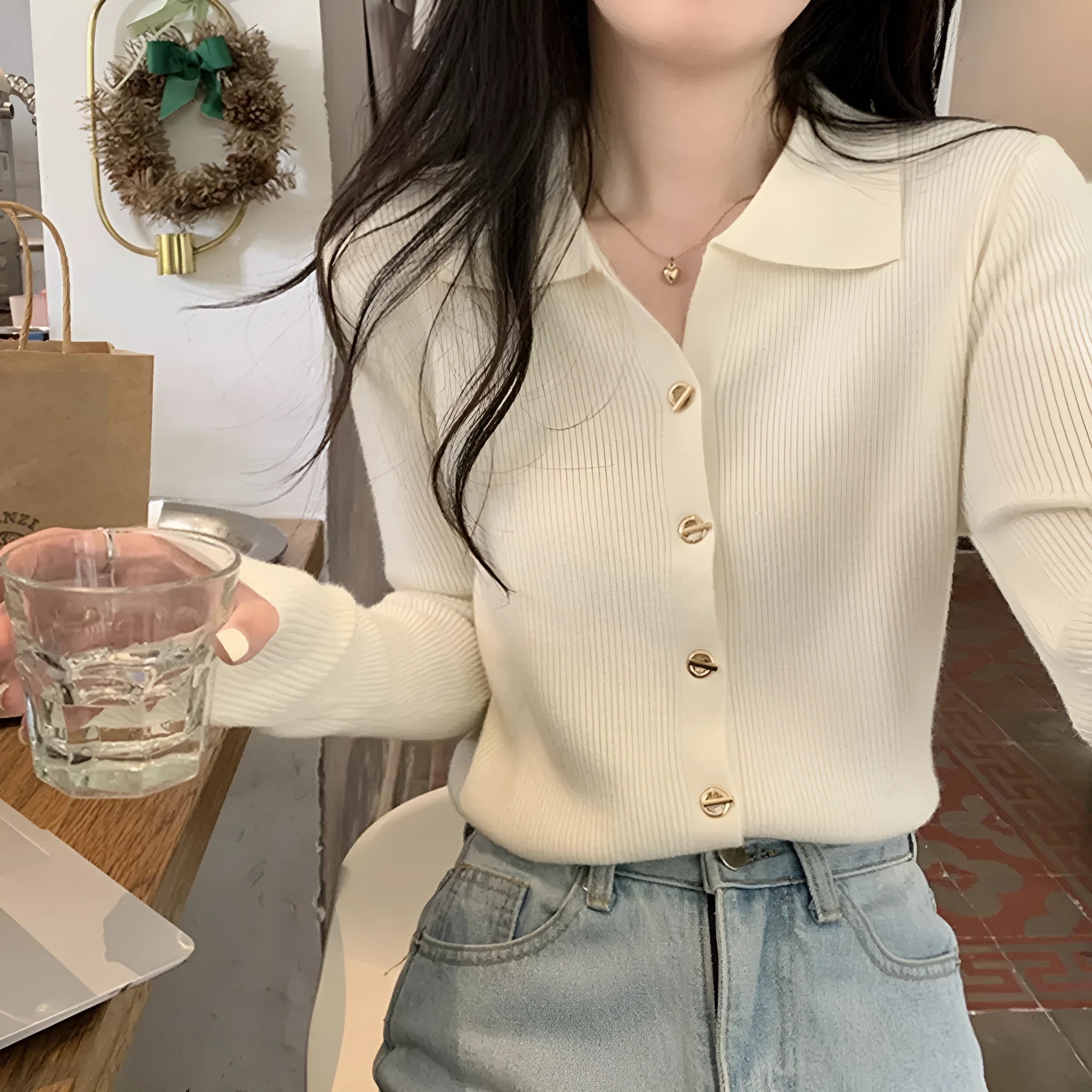 Beige loose-fit long-sleeve viscose knitted cardigan shown on a hanger.