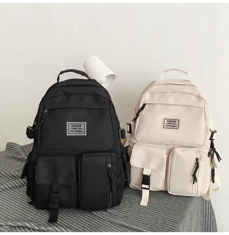 Soft nylon student backpack in black with laptop compartment and three-dimensional pocket