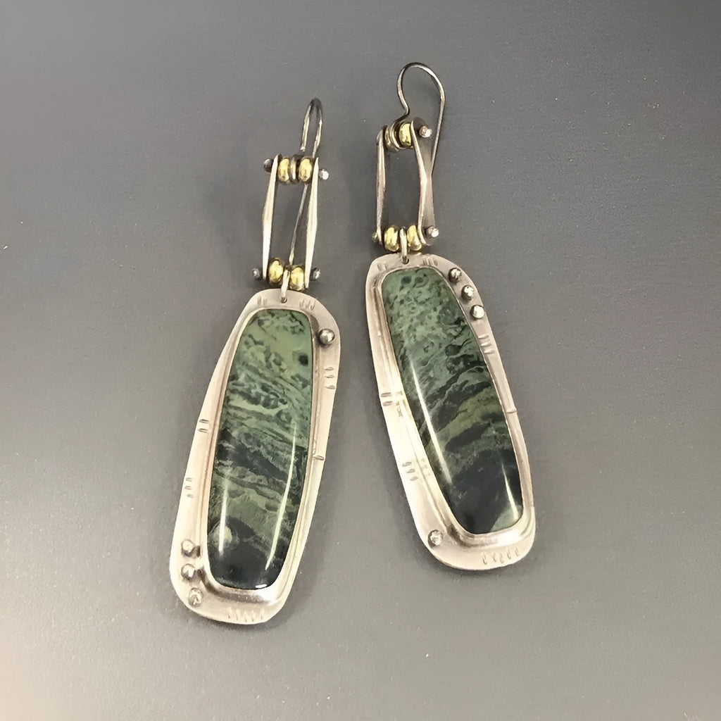 Two-tone marble pattern geometric drop earrings with alloy construction, front and side views