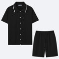 Man wearing a khaki short-sleeve knit top and matching shorts from a Tencel blend two-piece set.