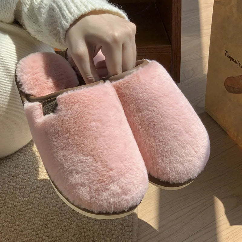A pair of solid colour plush winter slippers with a non-slip PVC sole, shown in available colours.