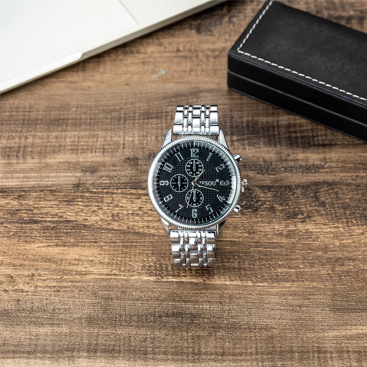 Steel band sport quartz watch with silver alloy case, stainless steel strap, and single fold buckle