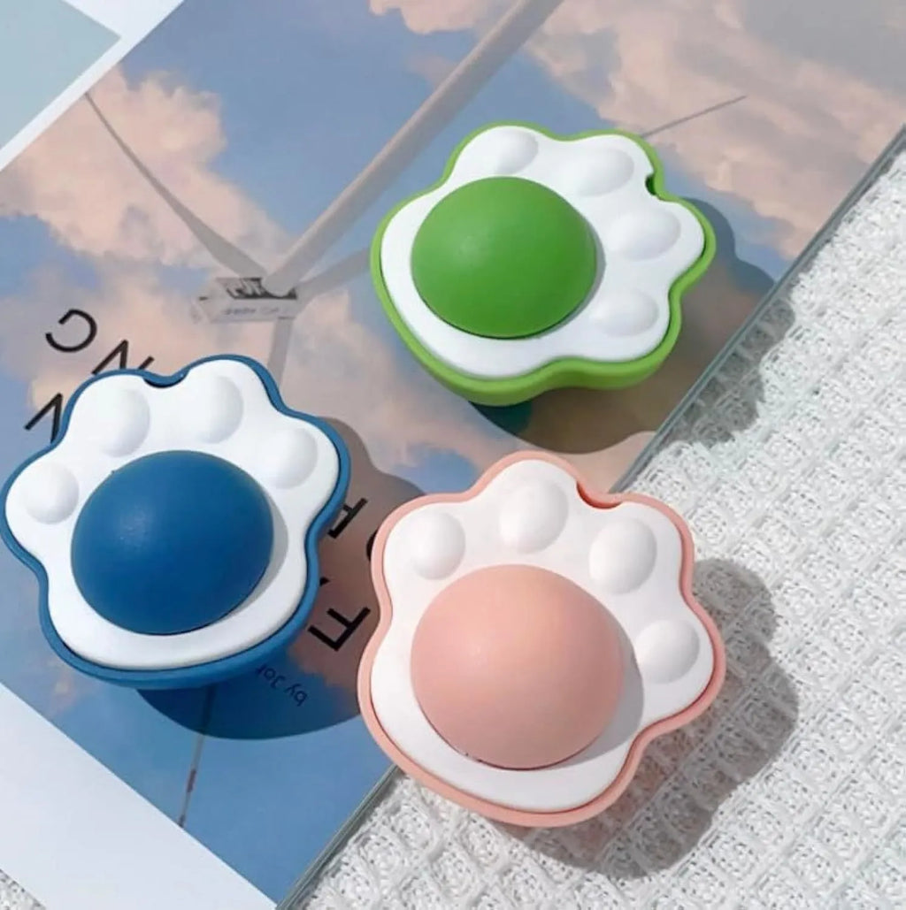 Blue, green and pink catnip ball wall treats with edible vine for feline dental chewing