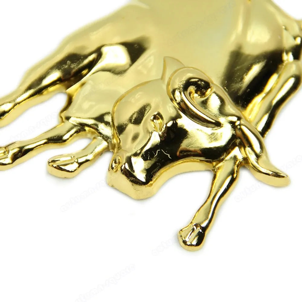 Gold metal car badge decal on a black car boot lid showing 3D profile