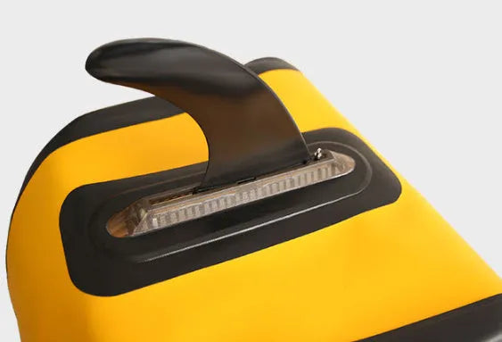 SUP paddle with large removable fish fins showing screw mounting system