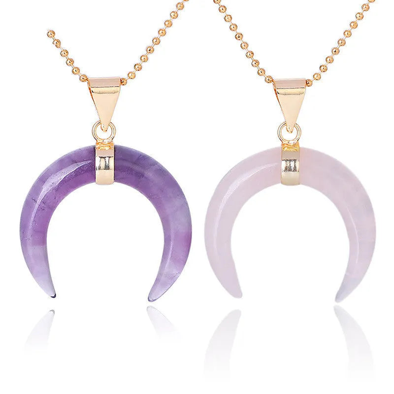Close-up of a pink natural stone moon pendant necklace on a 45cm chain with electroplated copper fittings.