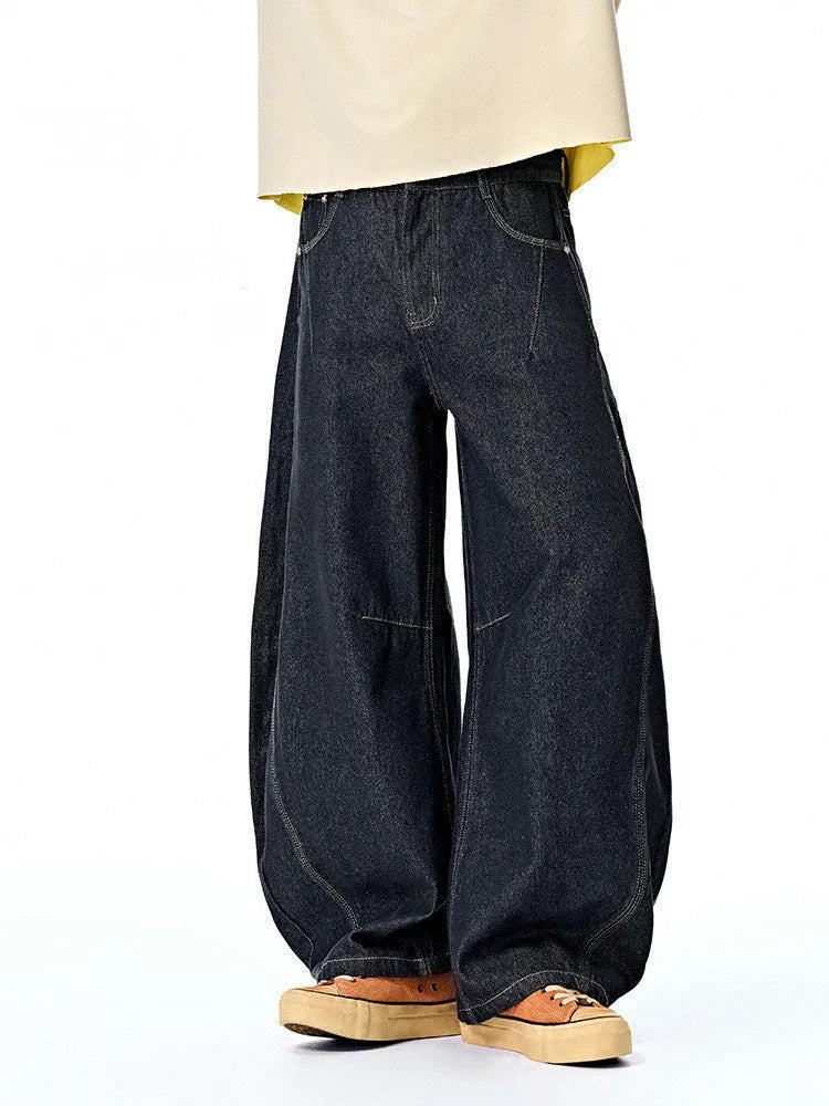 Men's wide leg denim trousers in original cow colour on a mid-waist model