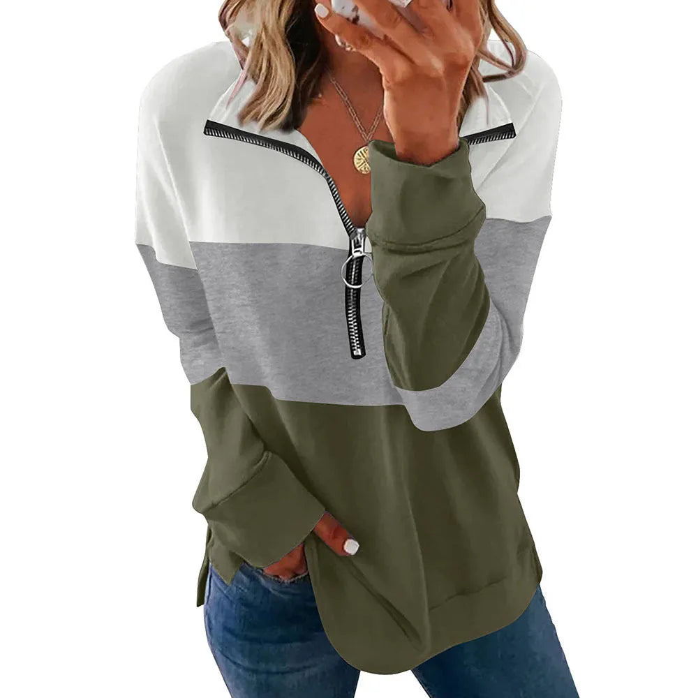 Women's loose long-sleeved leopard print pullover sweater in polyester on a hanger.