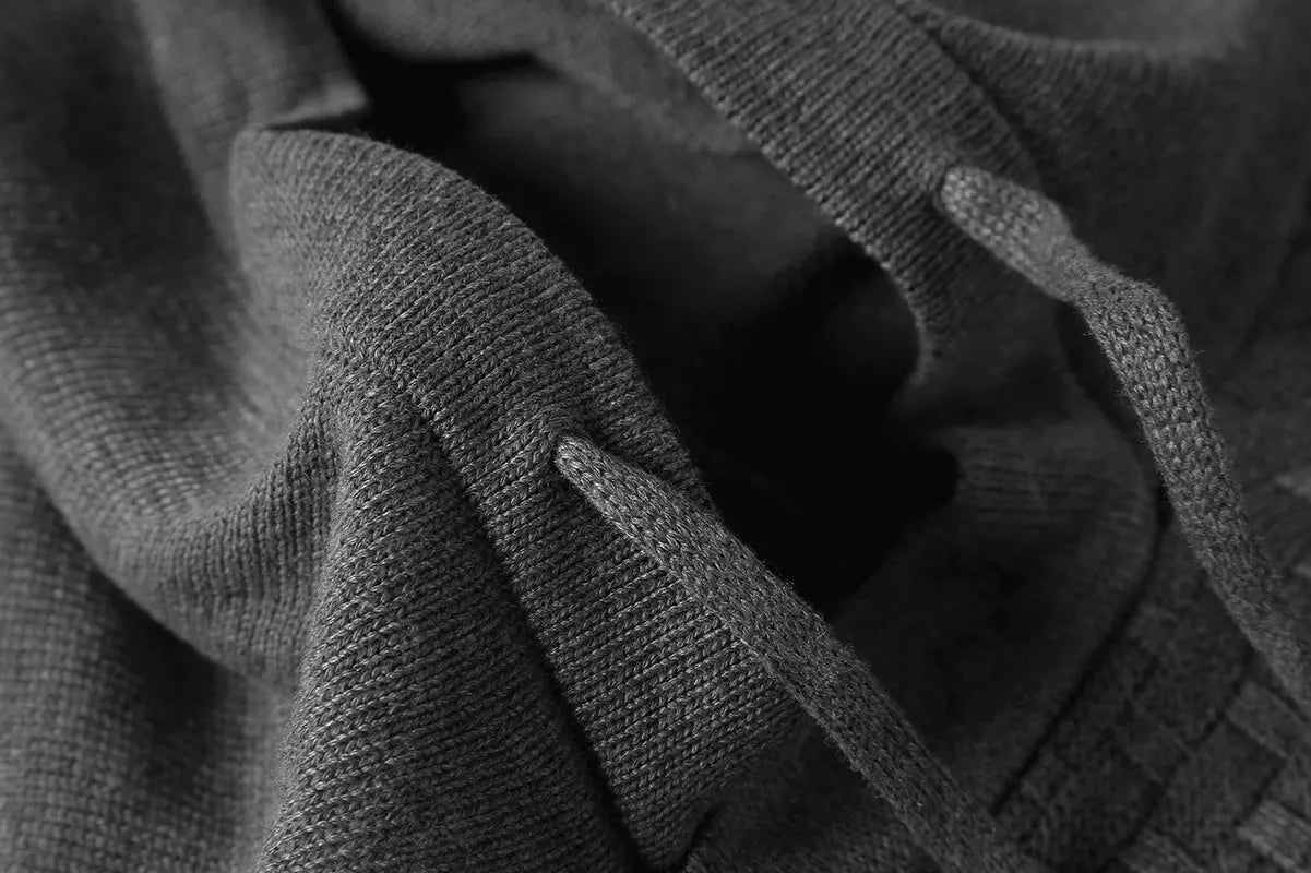 Men's black cotton-polyester hooded sweatshirt on a hanger