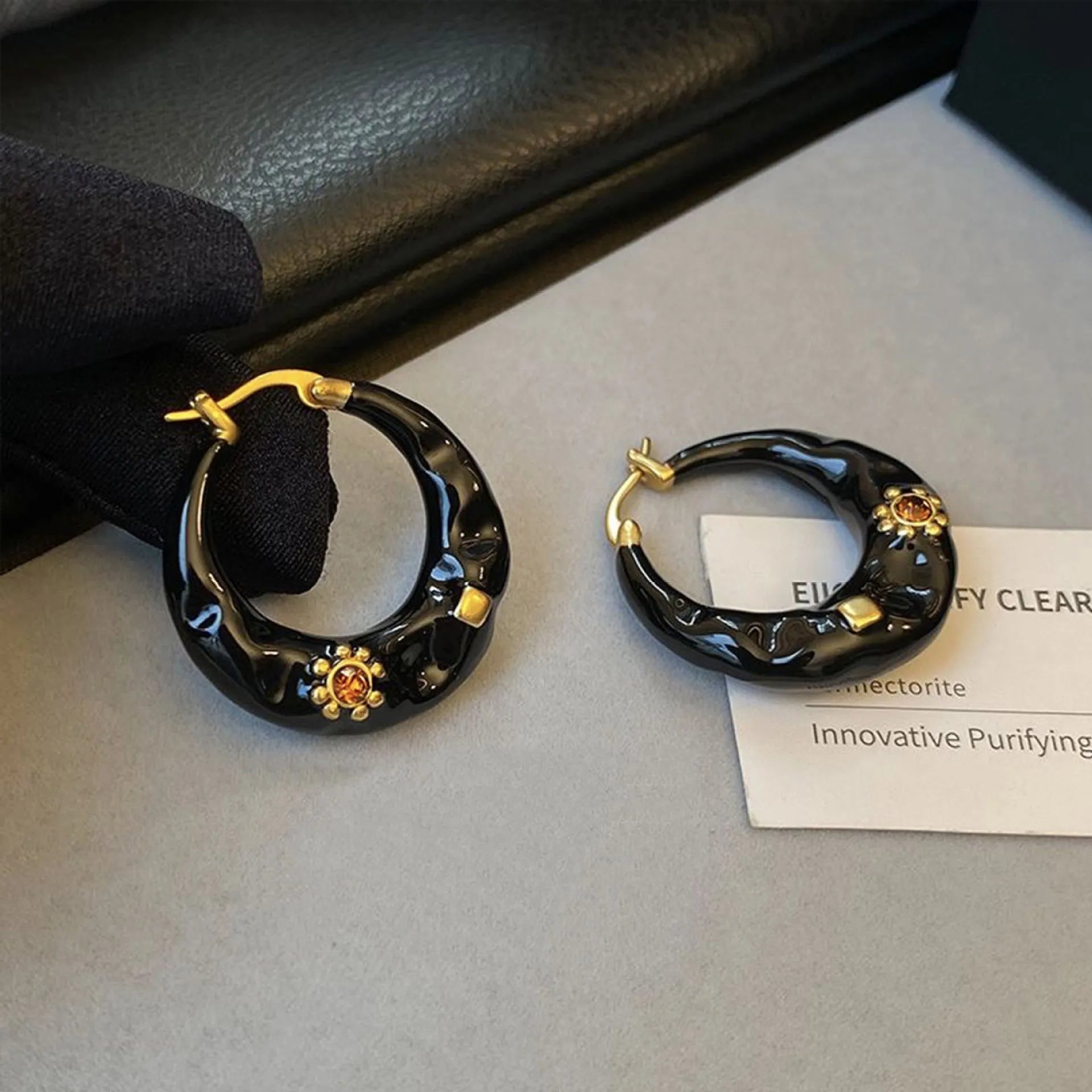Hong Kong style retro ear studs with drip oil texture and rhinestone decoration in black and red colours