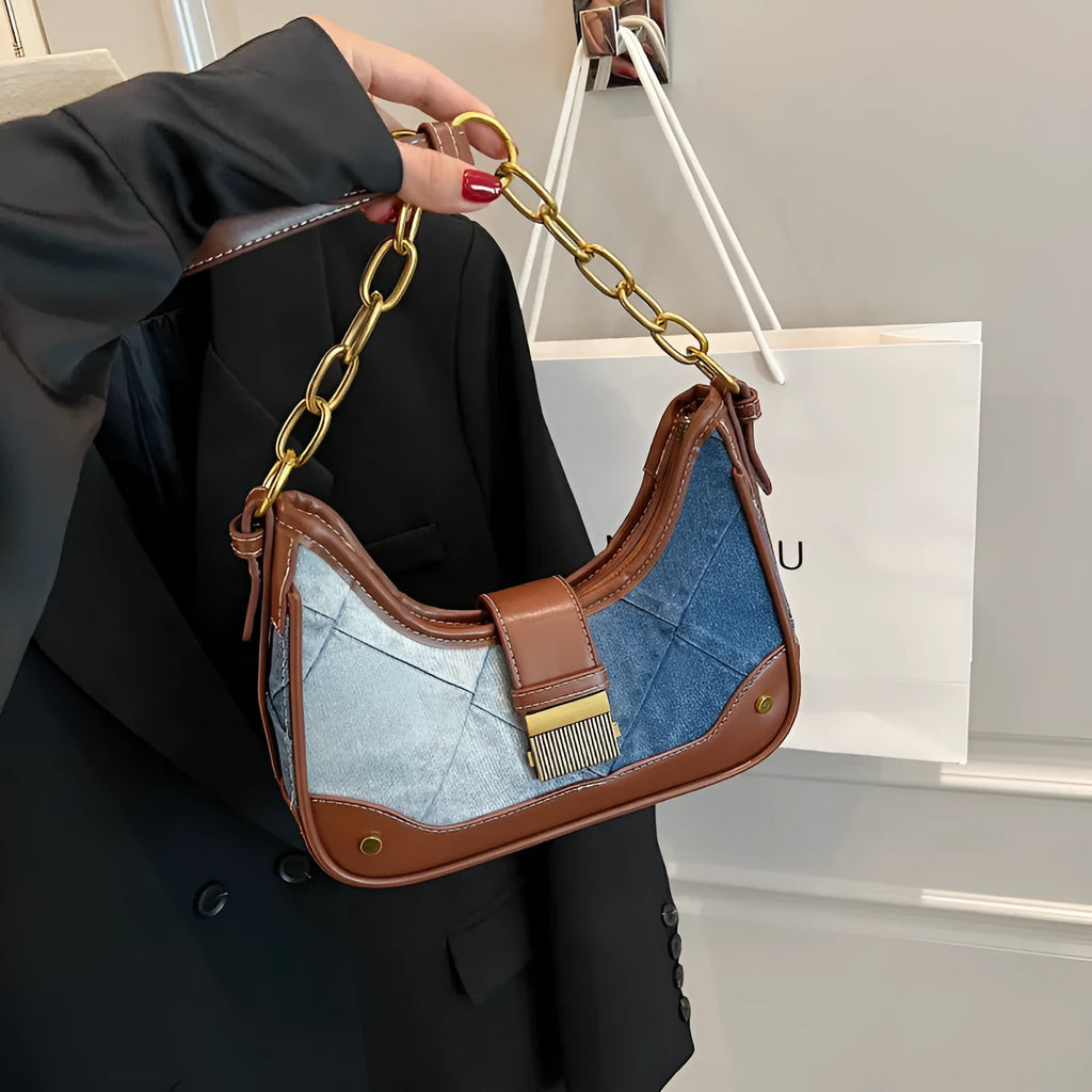 Brown denim bucket shoulder bag with diamond mesh panels and metallic chain strap