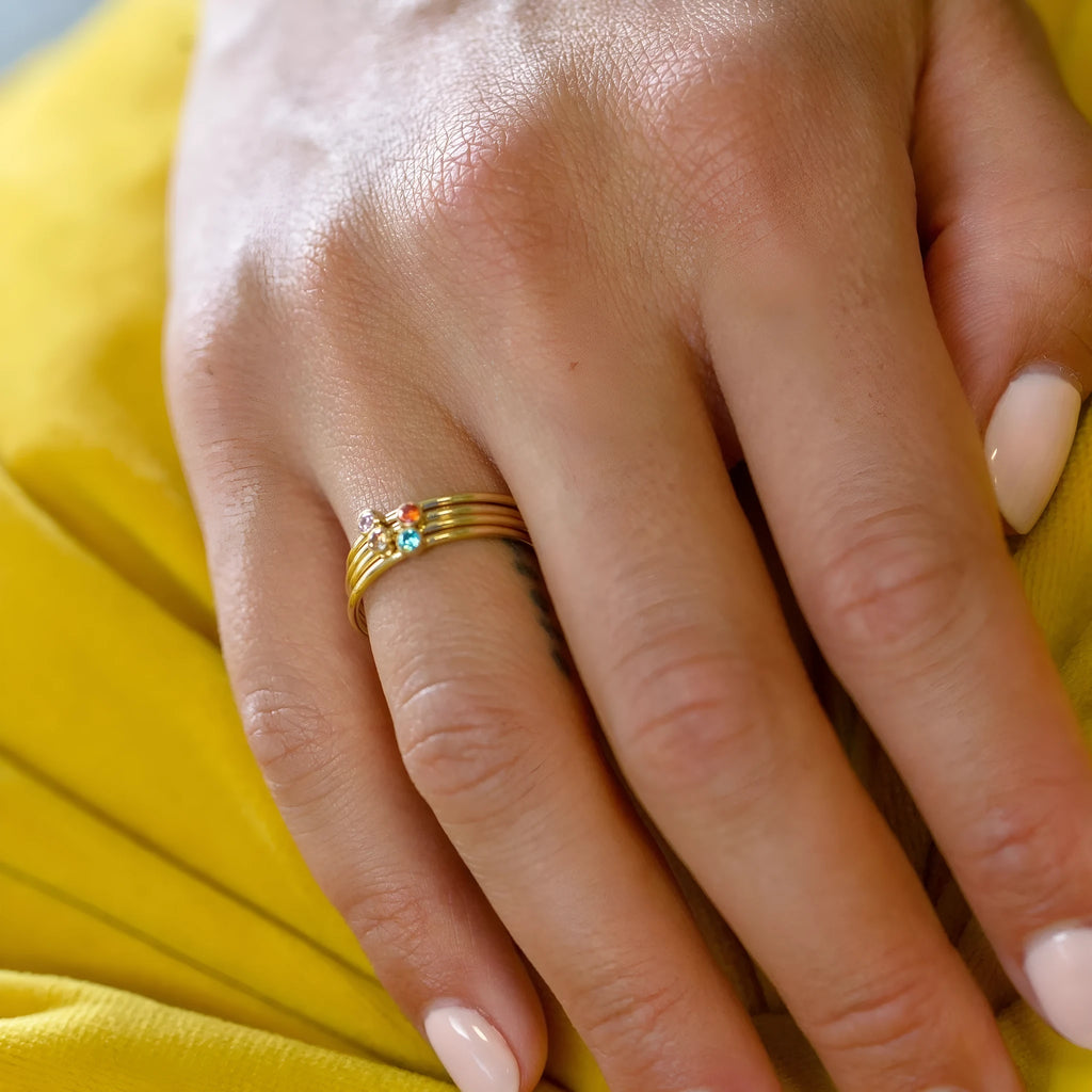 December birthstone titanium steel ring with engraved geometric design showing steel lettering and gold accents